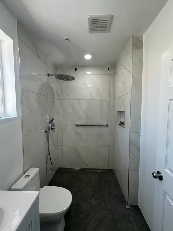 Bright finished bathroom remodel in Sherman Oaks with herringbone accent wall