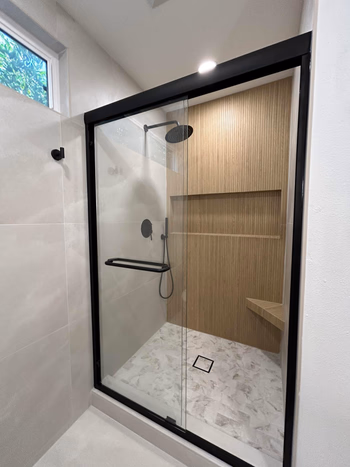 Guest bathroom remodel in Studio City with green walls and hex tiles